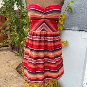 Fun strapless mini dress with bold sunset stripe pattern ❤️🧡💜